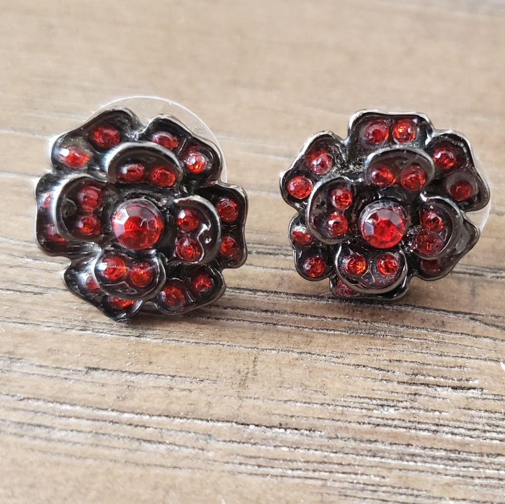 Red floral earrings for pierced ears.